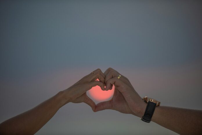 a close-up of hands shaking
